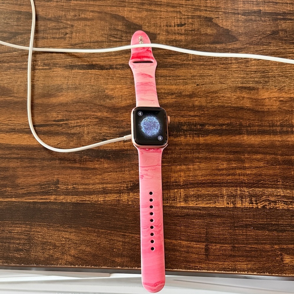 Apple Watch Series 5 (GPS) 40 mm with Pink Rubber Athletic Band.